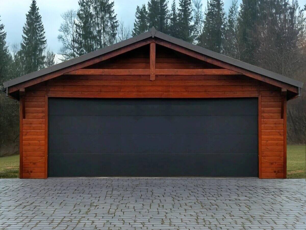 Timber-clad double garage with a graphite insulated sectional door