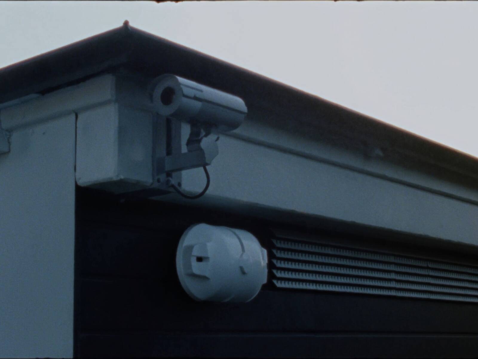 Security camera mounted at the eaves of a VeltHaven garage
