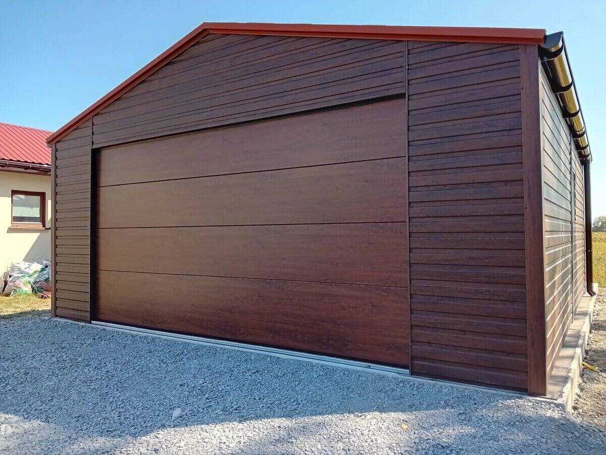 Steel garage with golden oak wood-effect door, residential driveway setting
