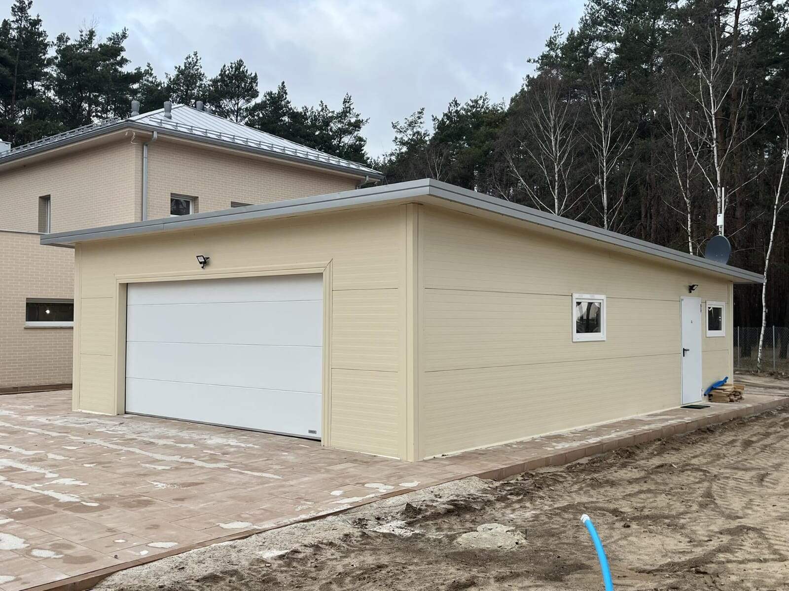 Beige insulated garage and house, wide angle view