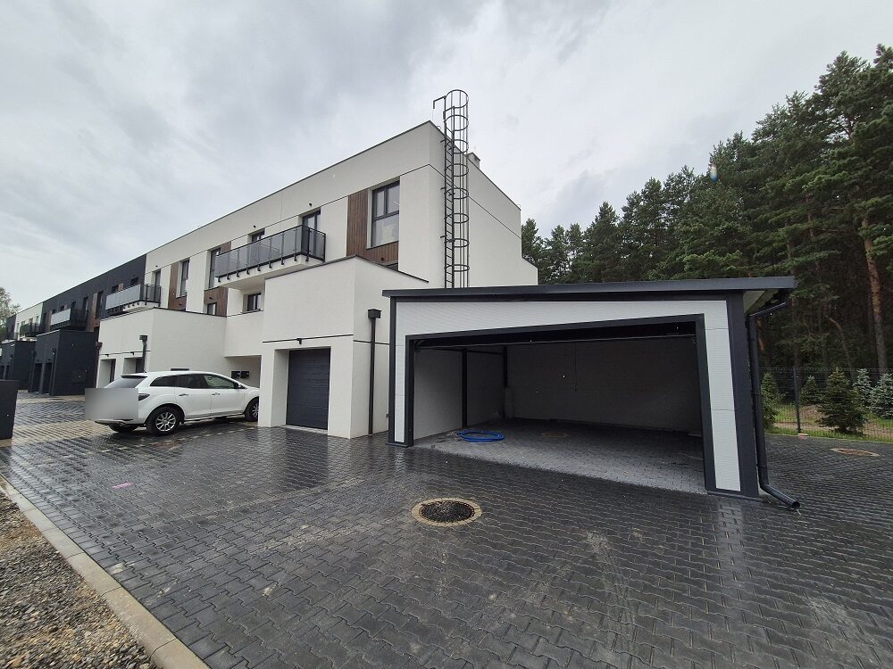 Insulated garage attached to a house, front elevation, door open