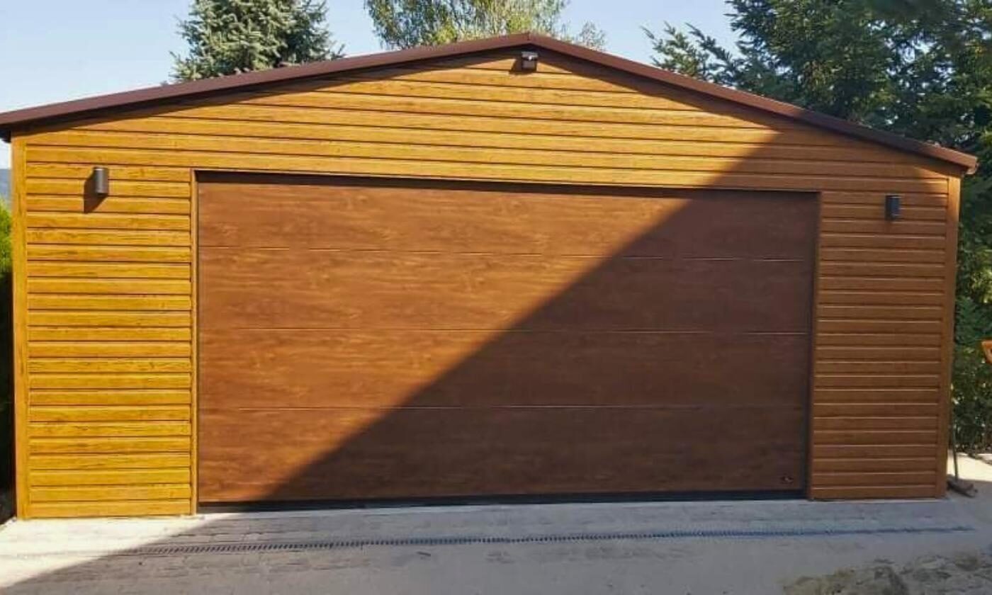Dark brown wood-effect steel garage, front elevation, sectional door closed
